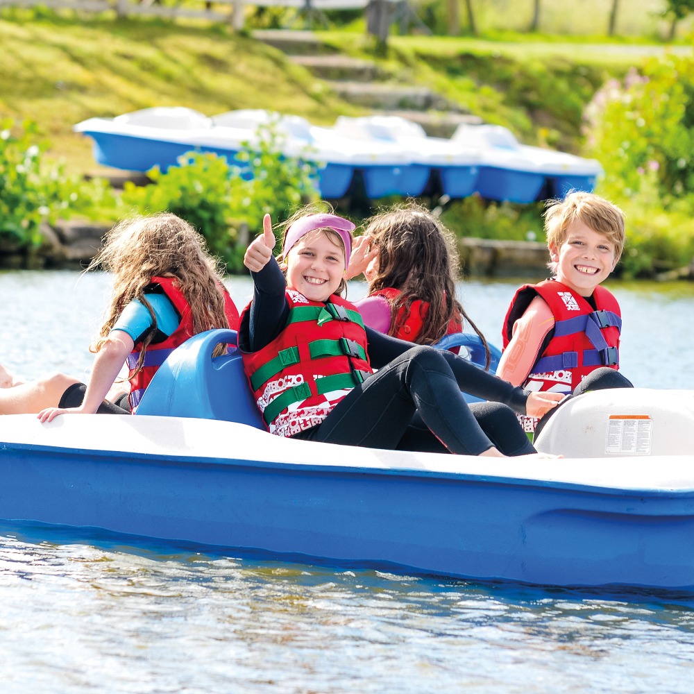 Kayaking and paddleboarding on a 20 acre spring-fed lake at Aztec Adventure