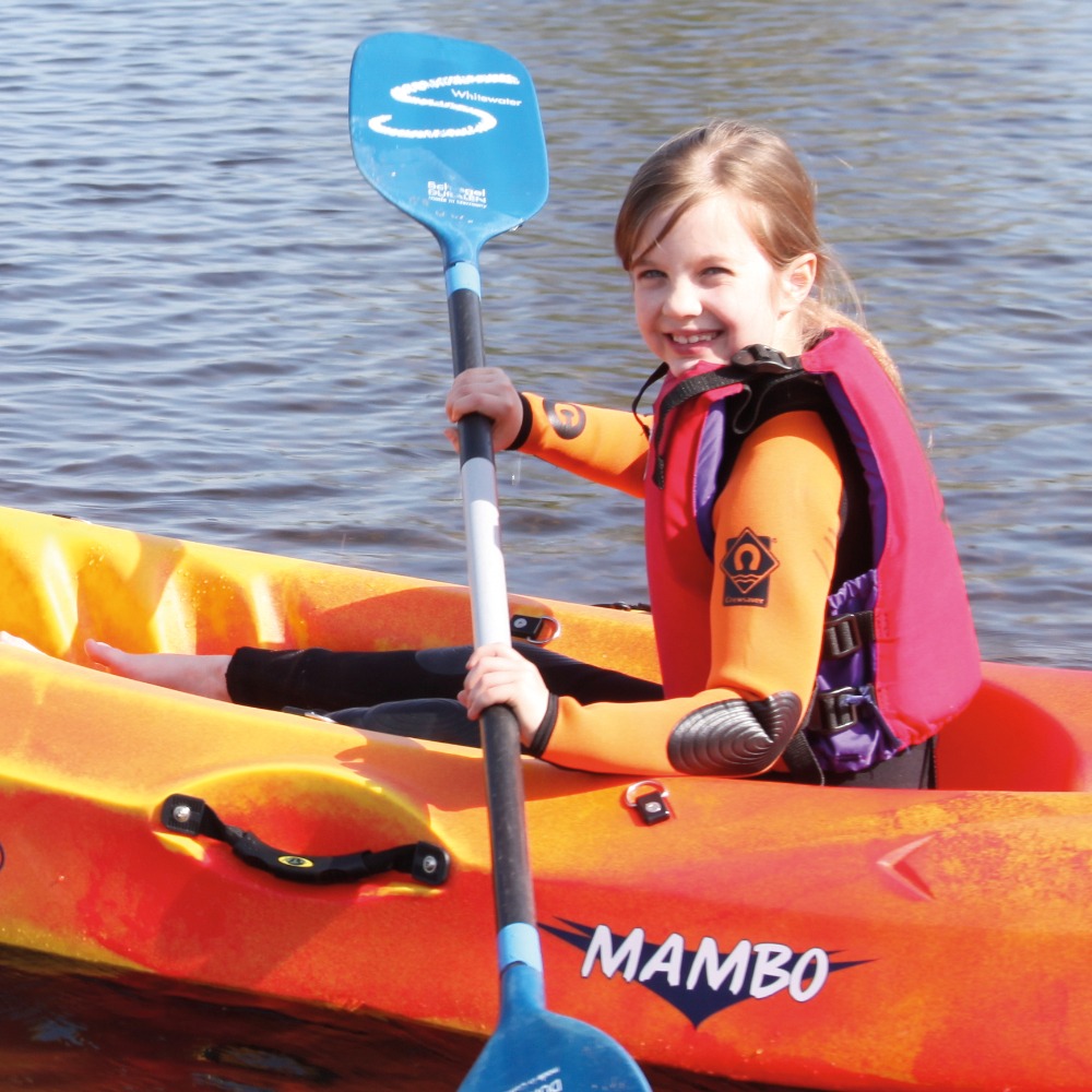 Girl on single sit on top kayak at Aztec Adventure Upton Warren
