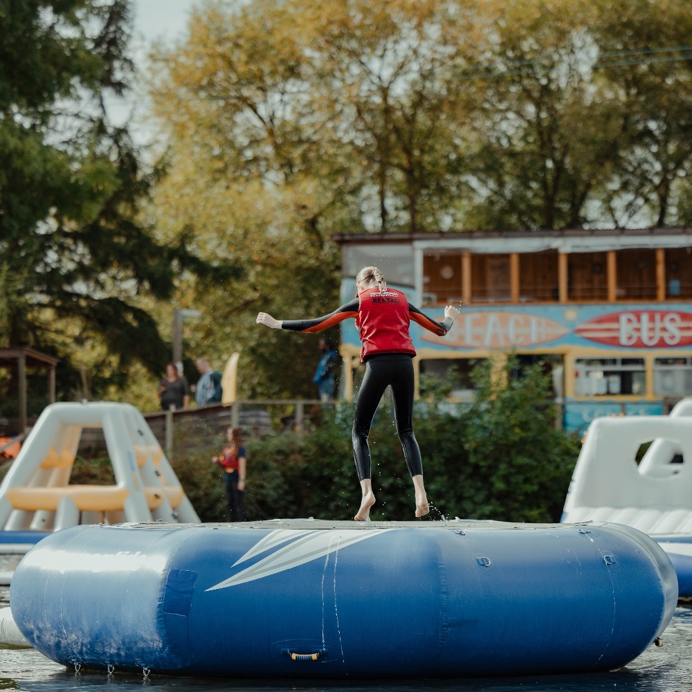 Aztec Adventure Aqua Park girl bouncing on trampoline