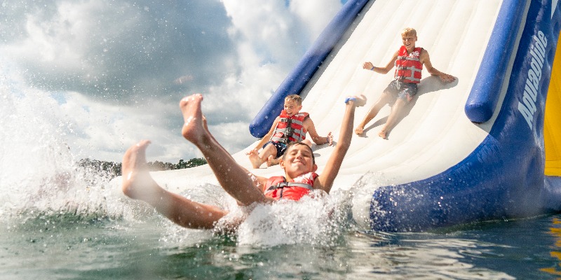 Aztec Adventure Aqua Park with children sliding down into water