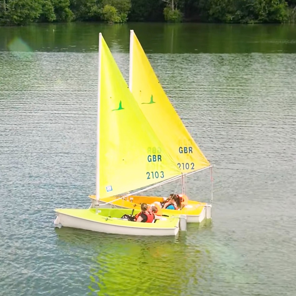 Participants from The Myriad Centre enjoying an inclusive sailing session with Aztec Adventure on a sunny day