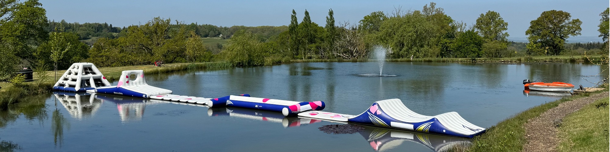 Aztec Adventure Aqua Park at Greentrees Estate, Sussex Inflatable water course at Aztec Adventure, Greentrees Estate Sussex