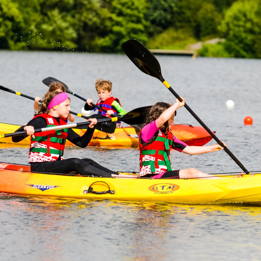 Kayaking and paddleboarding on a 20 acre spring-fed lake at Aztec Adventure