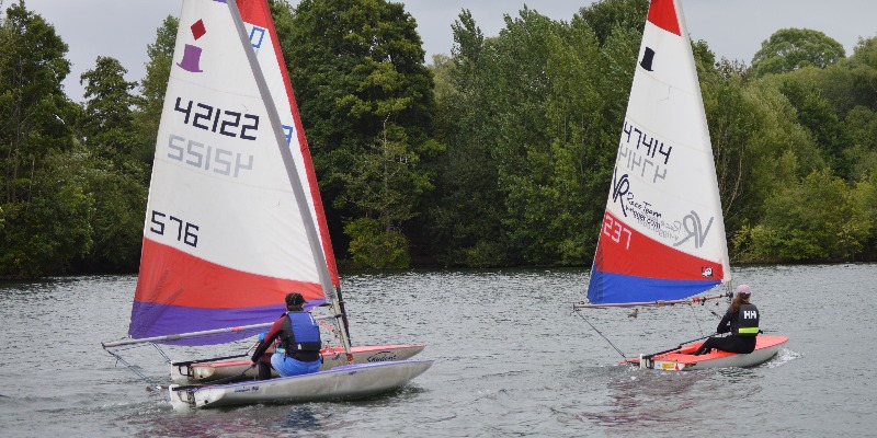 Children learning to sail on a RYA Youth Sailing Course at Upton Warren, enjoying summer outdoor adventure