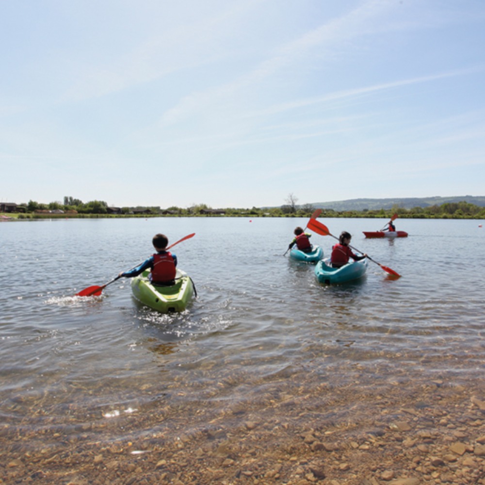 Children in single sit on top kayaks at Aztec Adventure Lower Moor