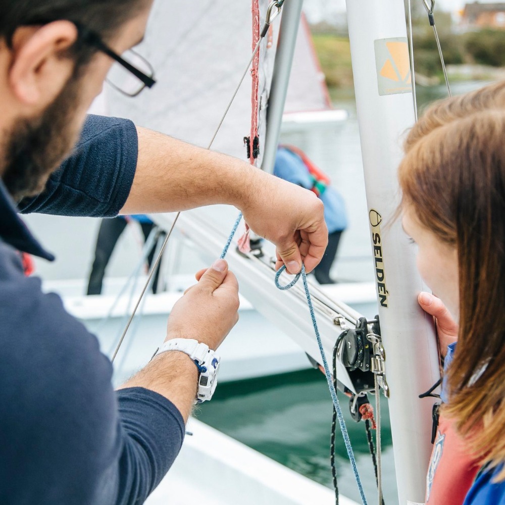 Instructor and girl on RYA sailing course at Aztec Adventure Upton Warren