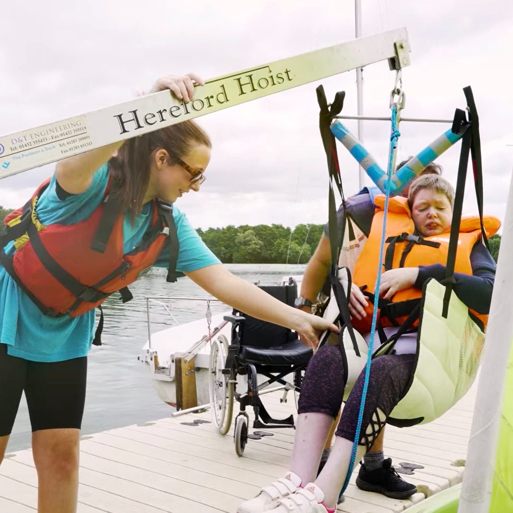 Participants from The Myriad Centre enjoying an inclusive sailing session with Aztec Adventure on a sunny day