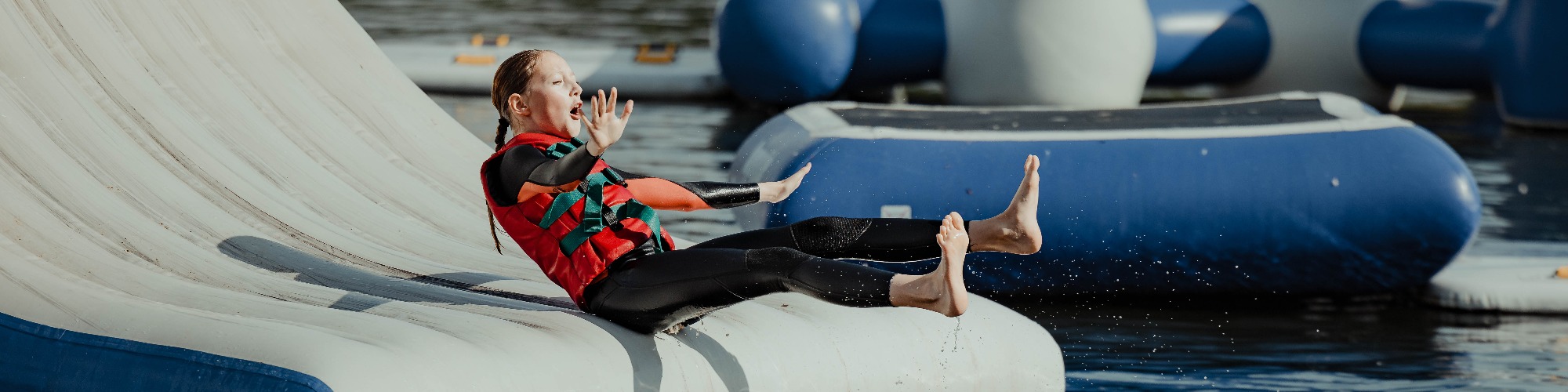 Child on the Aztec Adventure Aqua Park at Upton Warren in Worcestershire