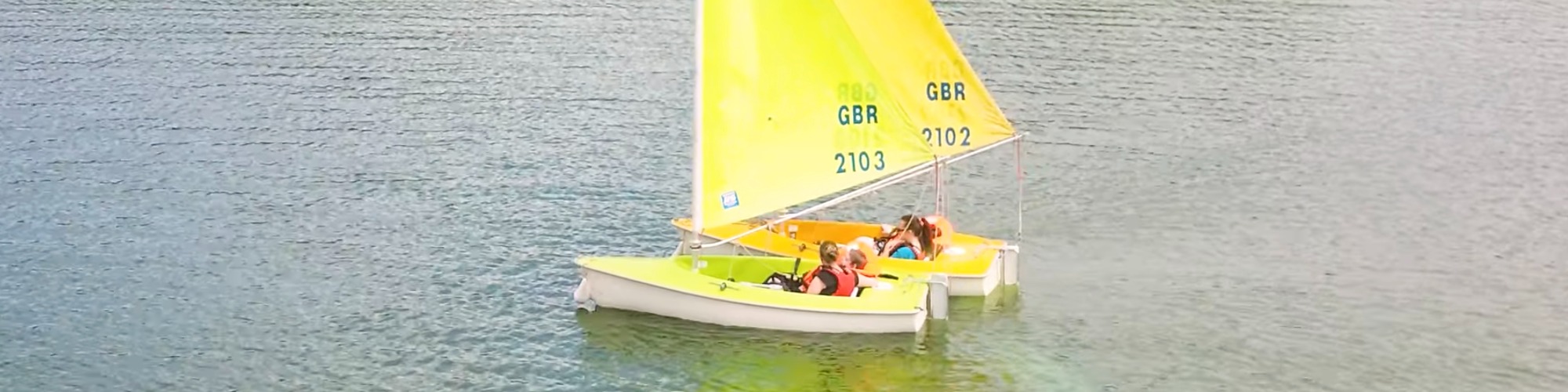 Participants from The Myriad Centre enjoying an inclusive sailing session with Aztec Adventure on a sunny day