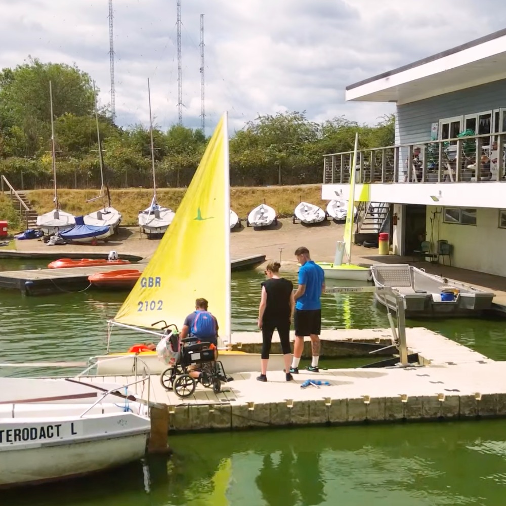 Participants from The Myriad Centre enjoying an inclusive sailing session with Aztec Adventure on a sunny day