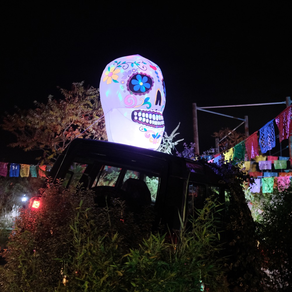 Neon Heights high ropes aerial adventure course glowing with neon lights, featuring zip lines, wobbly bridges, swingy steps, and a thrilling 70-metre zip wire descent under the night sky.