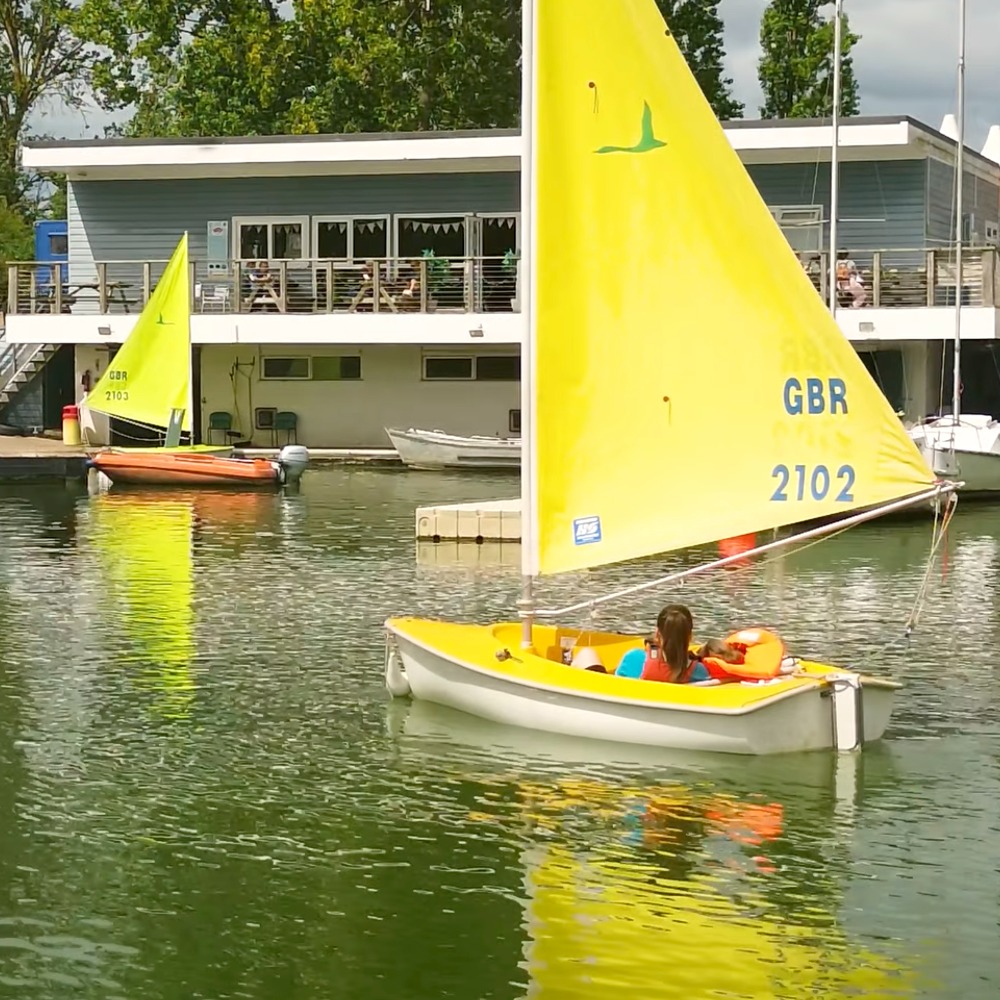 Participants from The Myriad Centre enjoying an inclusive sailing session with Aztec Adventure on a sunny day