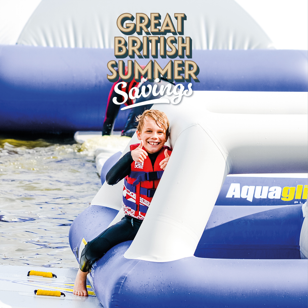 Families enjoying the Aztec Adventure Aqua Park - save this summer with Great British Summer Savings, 25 June to 1 September 2026.